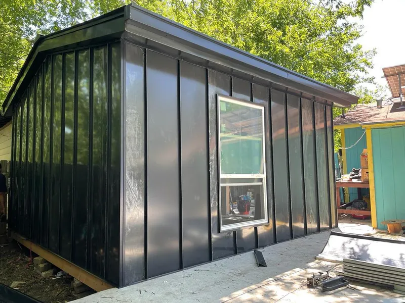 Black standing seam metal wall panels for Roof Inspection in Clayton